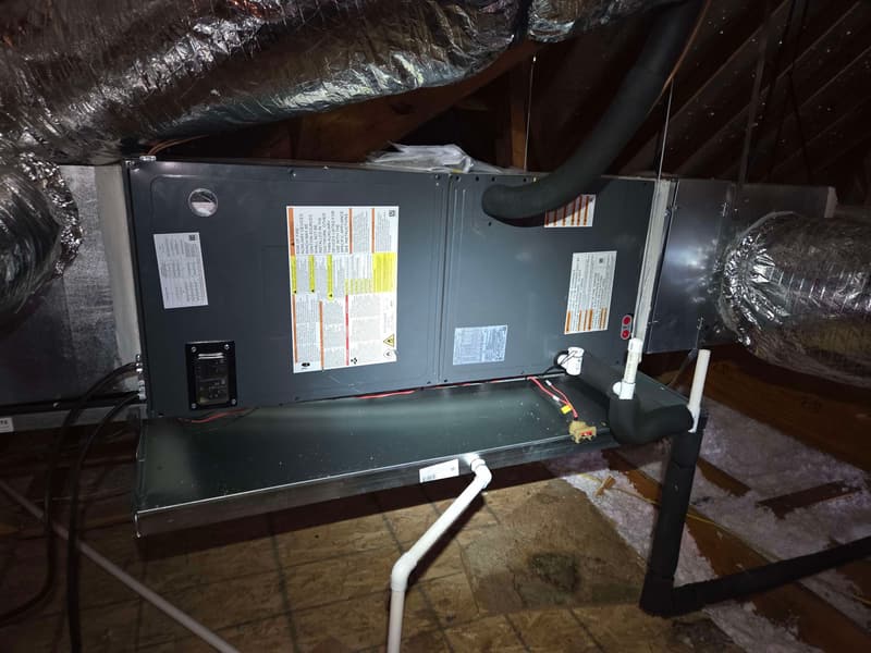 Horizontal air handler on a drain pan with a float switch in an attic