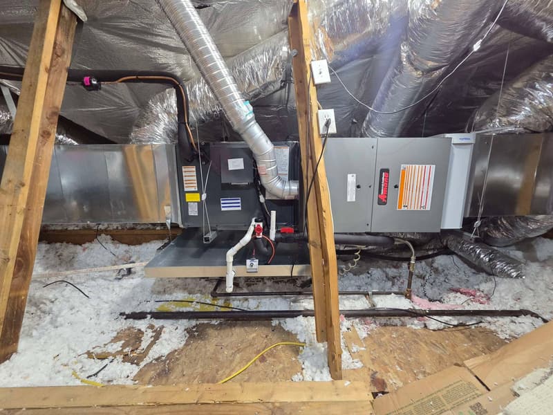 Amana gas furnace, evaporator coil and AprilAire media filter cabinet in an attic